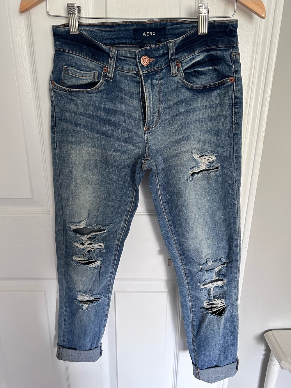 Aero Distressed Low-Rise Ankle Jeans